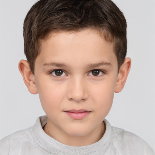 Joyful white child male with short  brown hair and brown eyes