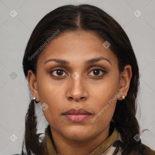 Joyful latino young-adult female with medium  brown hair and brown eyes