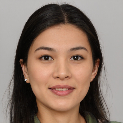 Joyful white young-adult female with long  brown hair and brown eyes