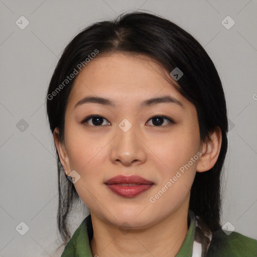 Joyful asian young-adult female with medium  black hair and brown eyes