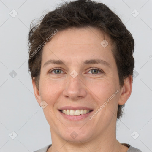 Joyful white adult female with short  brown hair and brown eyes