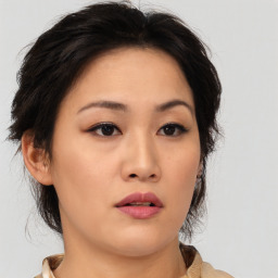 Neutral asian young-adult female with medium  brown hair and brown eyes