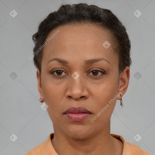 Joyful black adult female with short  brown hair and brown eyes