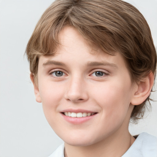 Joyful white child female with medium  brown hair and grey eyes