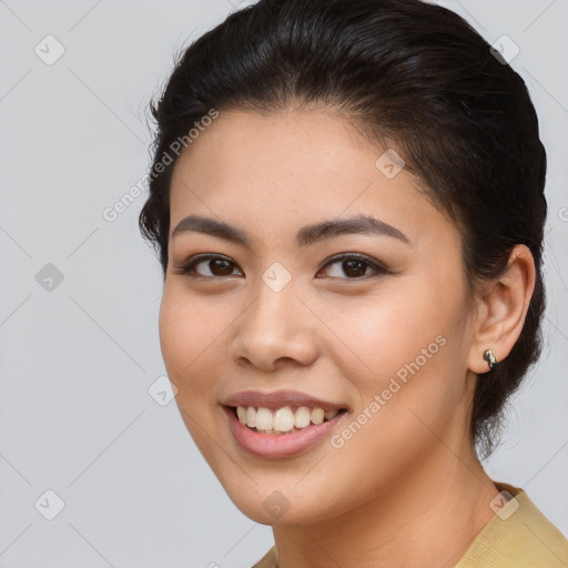 Joyful asian young-adult female with medium  brown hair and brown eyes