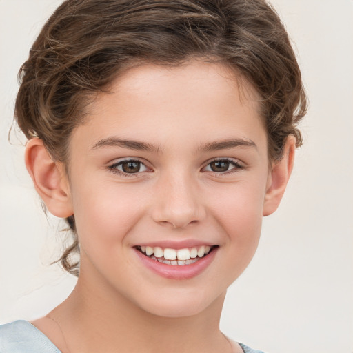 Joyful white child female with short  brown hair and brown eyes