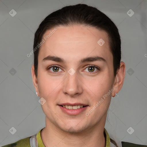 Joyful white young-adult female with short  brown hair and grey eyes