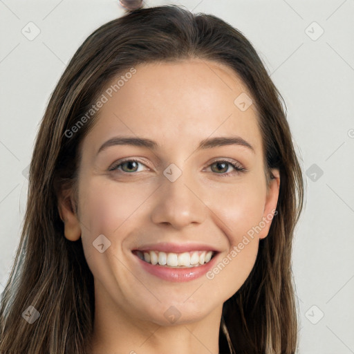 Joyful white young-adult female with long  brown hair and grey eyes