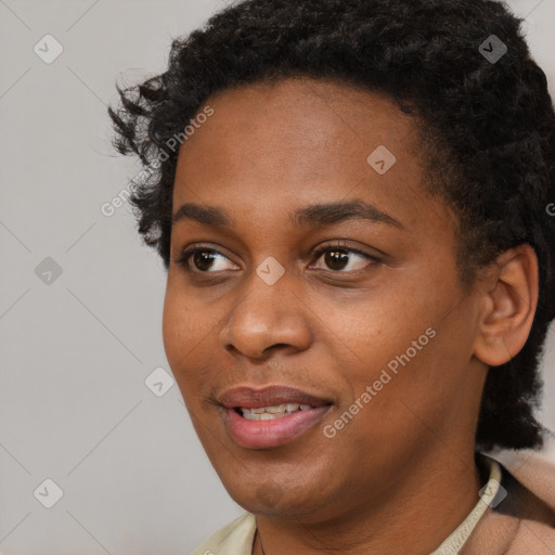 Joyful black young-adult female with short  black hair and brown eyes