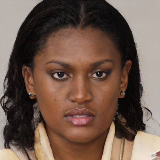 Neutral black young-adult female with medium  brown hair and brown eyes