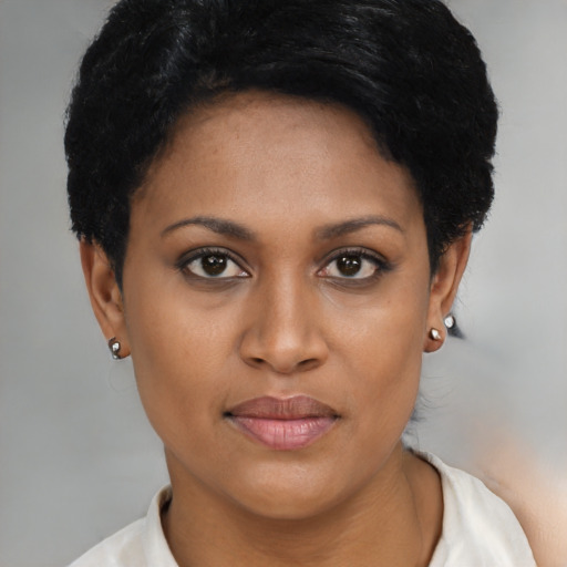Joyful asian young-adult female with short  black hair and brown eyes