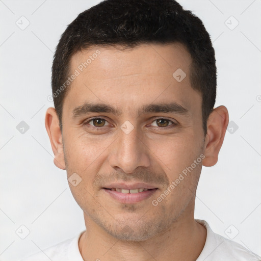 Joyful white young-adult male with short  brown hair and brown eyes