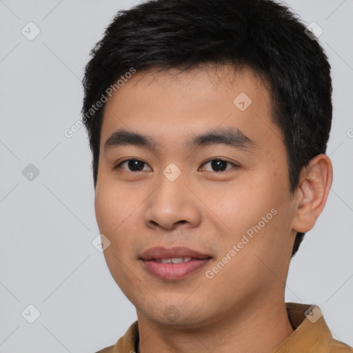 Joyful asian young-adult male with short  black hair and brown eyes