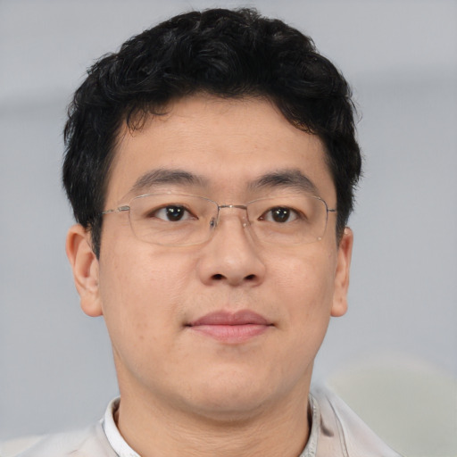 Neutral asian adult male with short  brown hair and brown eyes