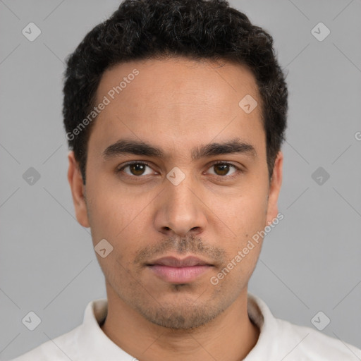 Neutral white young-adult male with short  black hair and brown eyes