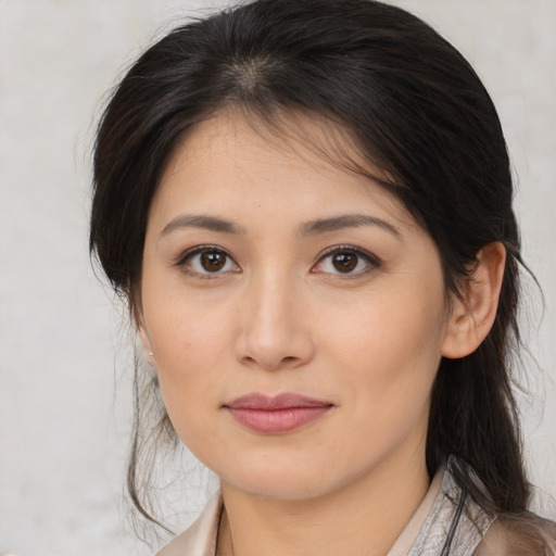 Joyful white young-adult female with medium  brown hair and brown eyes