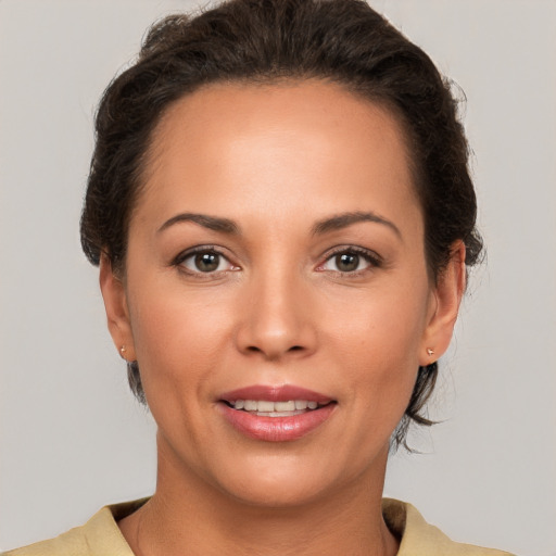 Joyful white young-adult female with short  brown hair and brown eyes