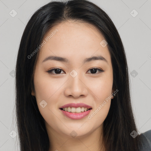 Joyful asian young-adult female with long  brown hair and brown eyes