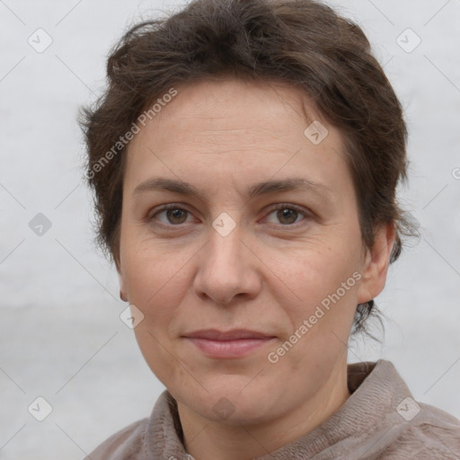 Joyful white adult female with short  brown hair and brown eyes