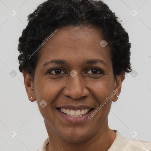 Joyful black adult female with short  brown hair and brown eyes