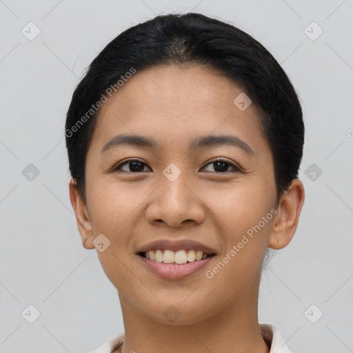 Joyful asian young-adult female with short  black hair and brown eyes