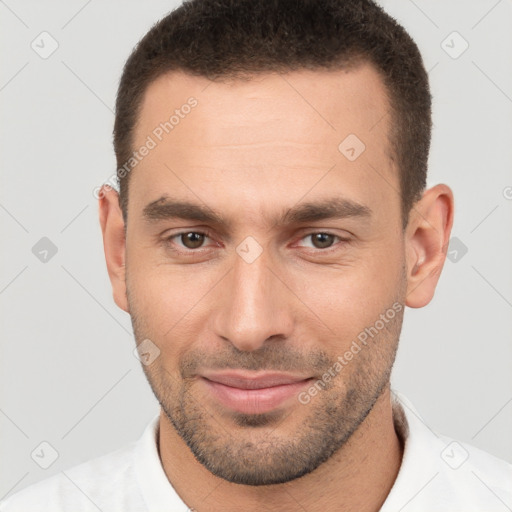 Joyful white young-adult male with short  brown hair and brown eyes