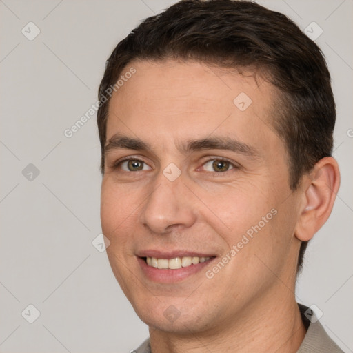 Joyful white young-adult male with short  brown hair and brown eyes