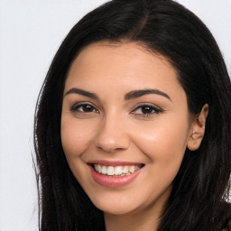 Joyful latino young-adult female with long  brown hair and brown eyes