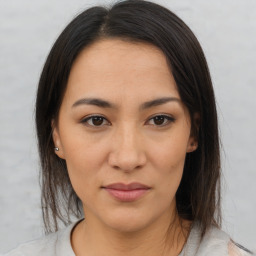 Joyful asian young-adult female with medium  brown hair and brown eyes