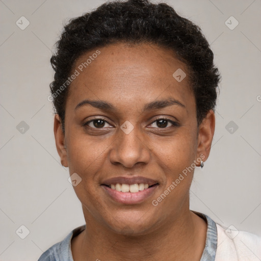 Joyful black young-adult female with short  black hair and brown eyes