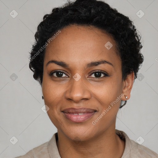 Joyful black young-adult female with short  black hair and brown eyes