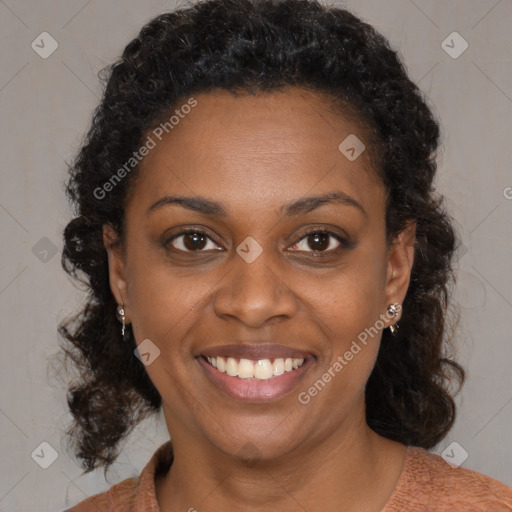 Joyful black young-adult female with medium  brown hair and brown eyes