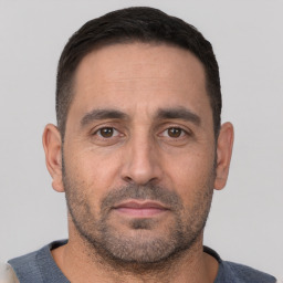 Neutral white adult male with short  black hair and brown eyes