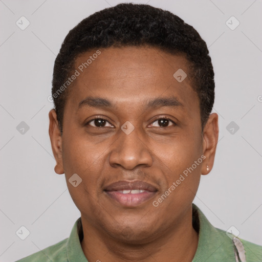 Joyful latino young-adult male with short  brown hair and brown eyes