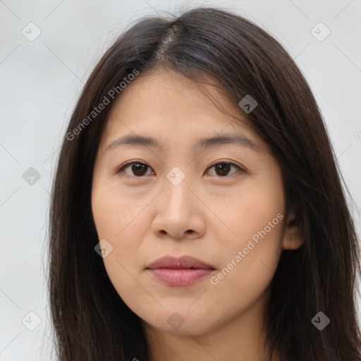 Joyful asian young-adult female with long  brown hair and brown eyes