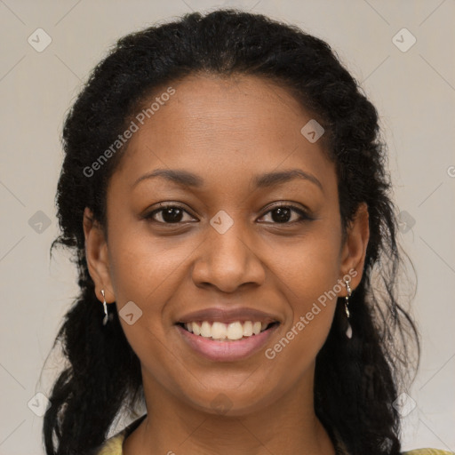 Joyful black young-adult female with long  brown hair and brown eyes