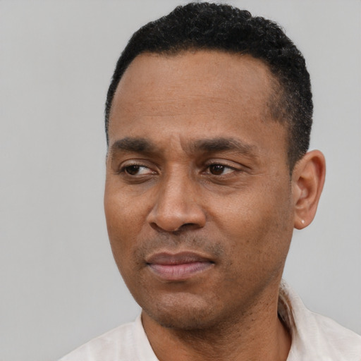 Neutral latino adult male with short  black hair and brown eyes