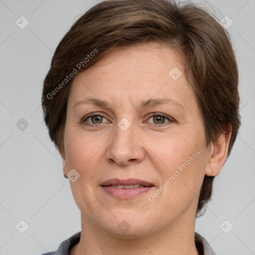 Joyful white adult female with short  brown hair and grey eyes