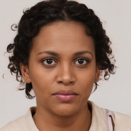 Neutral black young-adult female with short  brown hair and brown eyes