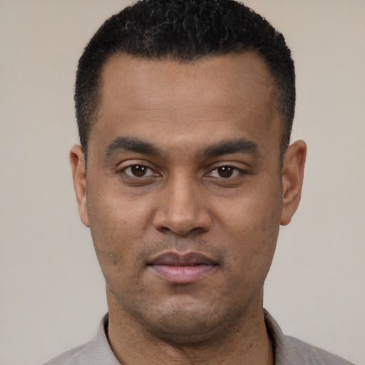 Neutral latino young-adult male with short  black hair and brown eyes