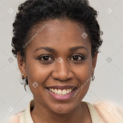 Joyful black young-adult female with short  brown hair and brown eyes