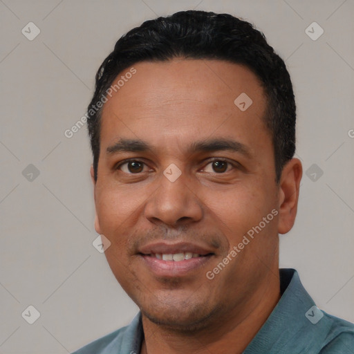 Joyful white young-adult male with short  black hair and brown eyes