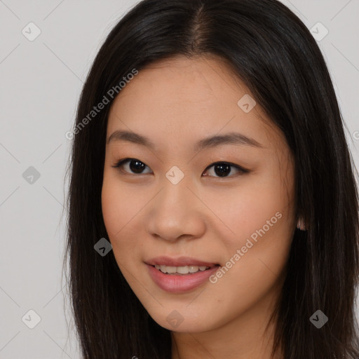 Joyful asian young-adult female with long  brown hair and brown eyes