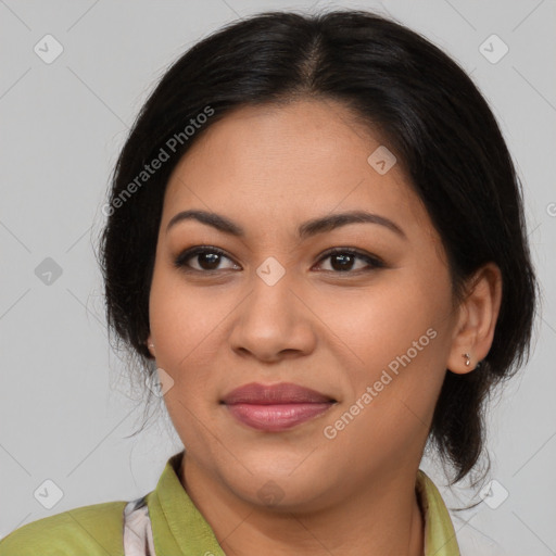 Joyful latino young-adult female with medium  brown hair and brown eyes