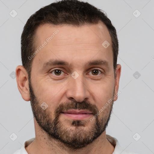 Joyful white adult male with short  brown hair and brown eyes