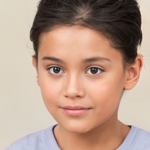 Joyful white child female with short  brown hair and brown eyes