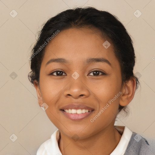 Joyful latino young-adult female with short  brown hair and brown eyes