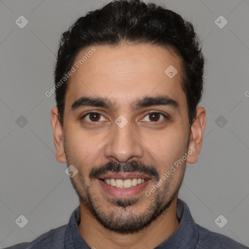 Joyful white young-adult male with short  black hair and brown eyes