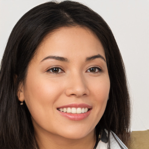 Joyful white young-adult female with long  brown hair and brown eyes