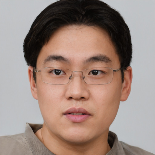 Neutral asian young-adult male with short  brown hair and brown eyes